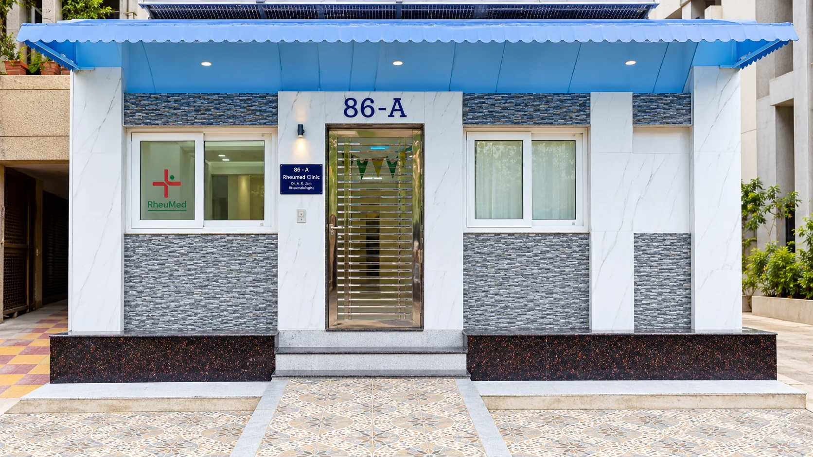 Enhanced entrance view based on the original Rheumed clinic photograph, showing 86-A over the doorway in Dwarka